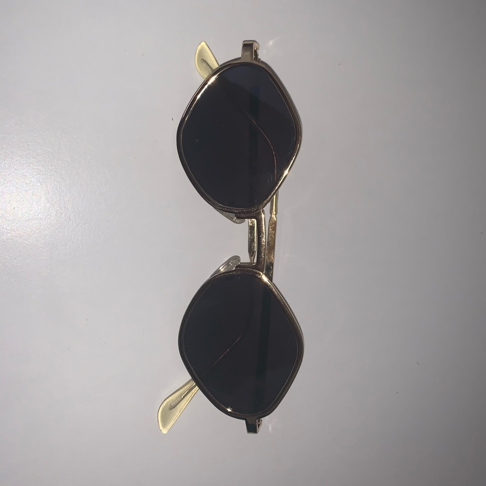 Gold and black sunglasses